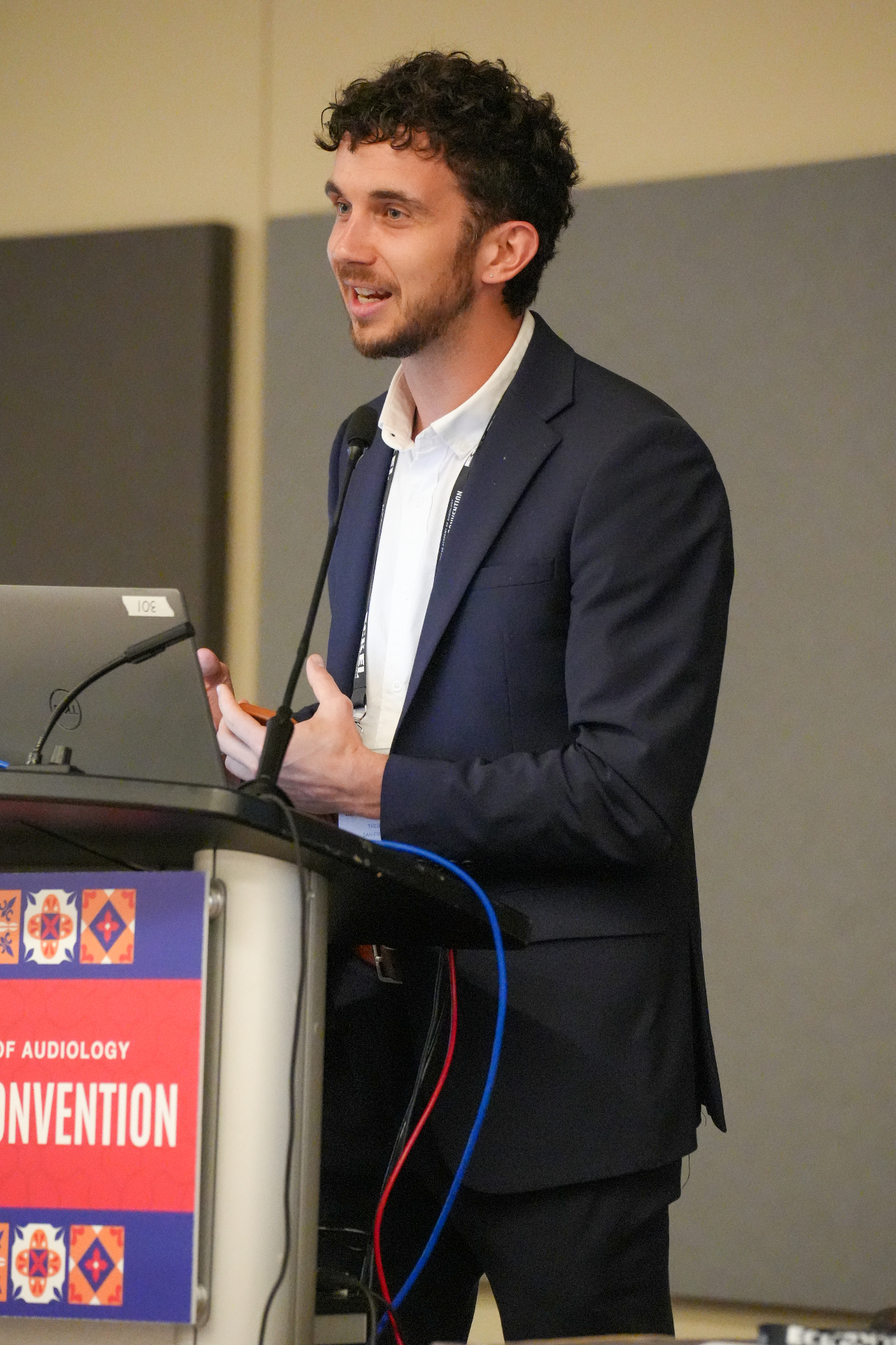Ben presenting on stage