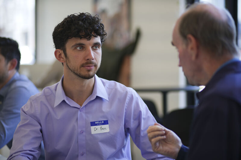 Ben listening to a patient